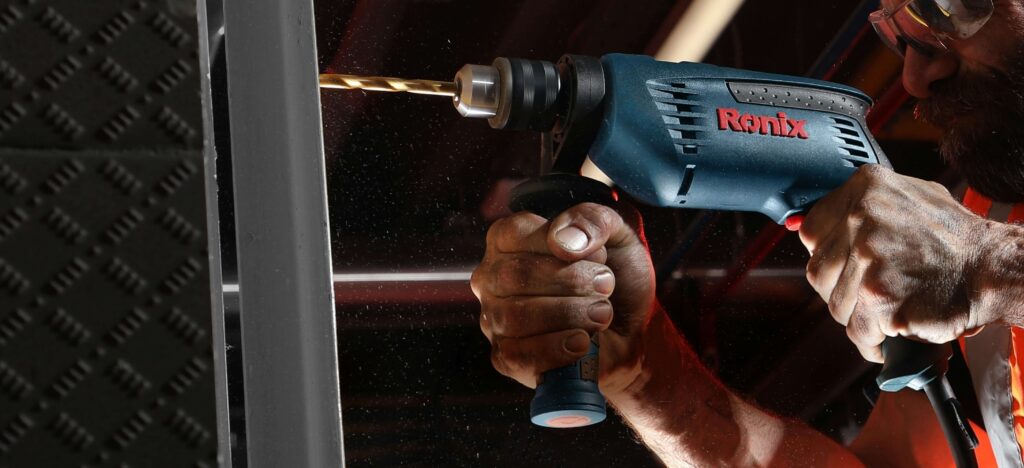 Professional using a cordless power tool on jobsite